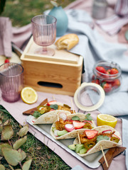 Grilled meat tacos served in a picnic