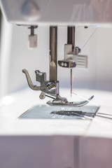 Sewing at home: Close up picture of sewing needle