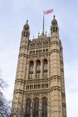 Fototapeta na wymiar Houses of Parliament with the Union Jack Flag, London. Landmark, monument.