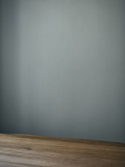 Background withwooden board table srface and grey wall