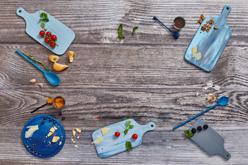 Decorated blue wooden boards on a rustic wooden surface