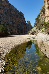 Beautiful landscapes in Sa Calobra, a gravelly rock beach that makes its way between a large mountain. Mallorca, Spain