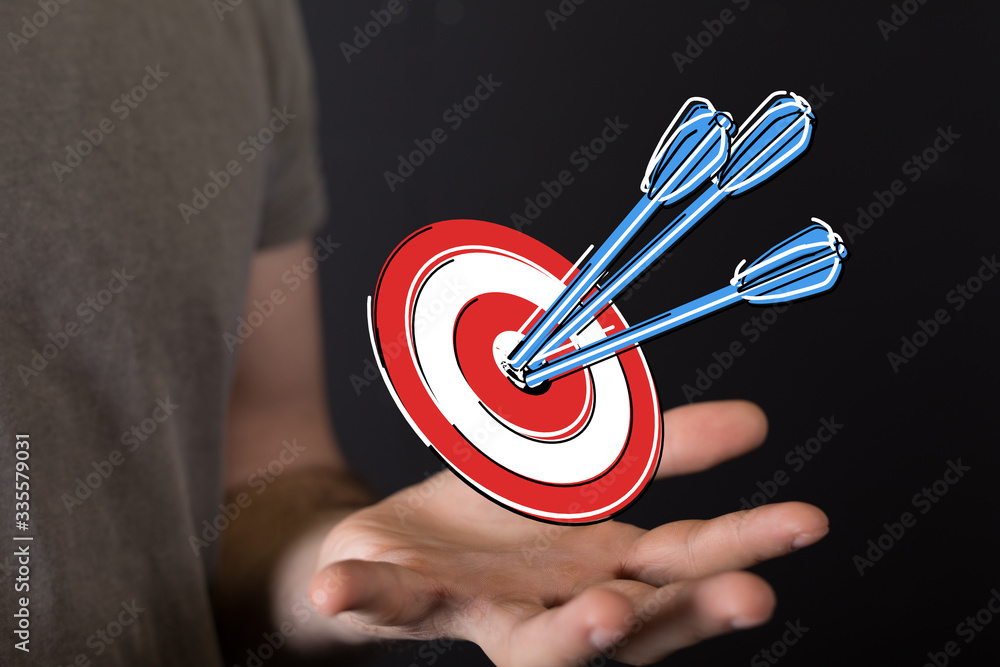 Aufkleber  makes a dart throw on the target. The concept of persistence in business..