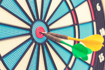 Dart arrows in target center. Success concept