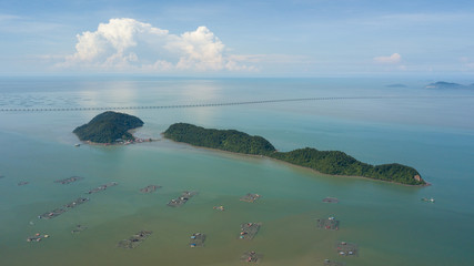 Aerial view fish farm near Pulau Aman and Pulau Gedong in sunny day.