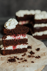 Chocolate cake with cream and raspberries. Cut piece