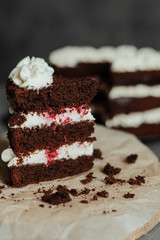 Chocolate cake with cream and raspberries. Cut piece