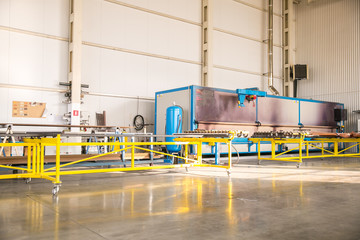 Industrial plant for production of metal profile for windows