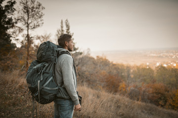 Young Backpacker Hiking In Autumn Nature