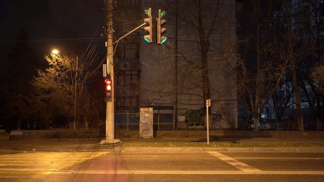 Simferopol empty city streets at night in autumn. Pedestrian crossing traffic lights.