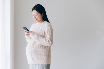 Portrait of young Asian pregnant woman
