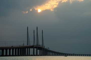Sun appear through cloud at Penang second bridge in morning.