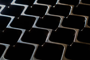 Dark minimalistic plastic mesh texture. Geometric pattern.