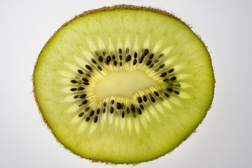 Close-up of kiwi slice, white background