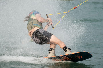 Young athlete Of Thailand is practicing sportWater Board at the wake park canal 6 on October 7,...