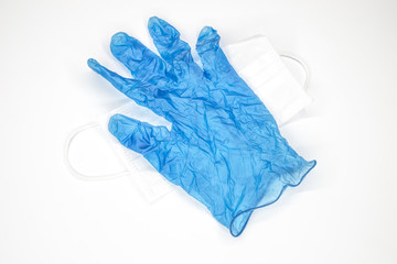 Medical mask and gloves on the white background, protection against coronavirus