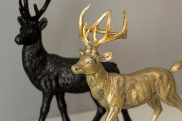 Golden and black ornament deer statues