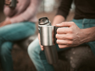 Males Hand With Cup And Thermos, Camping Break