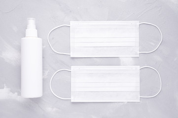 white medical masks and disinfect spray for virus protection