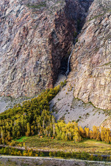 Waterfall in a mountain gorge. The confluence of the Karasu River into the Chulyshman River....