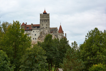 Fototapeta na wymiar Bran Castle, former royal residence and castle of the legendary Count Dracula. Medieval fortification.