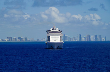 MSC Seaside frontal modern cruiseship or cruise ship liner at sea with skyline of Miami or South...