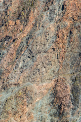 The texture of the rocky slope of a mountain gorge. Russia, Altai Republic, Ulagansky District, Chulyshman Valley