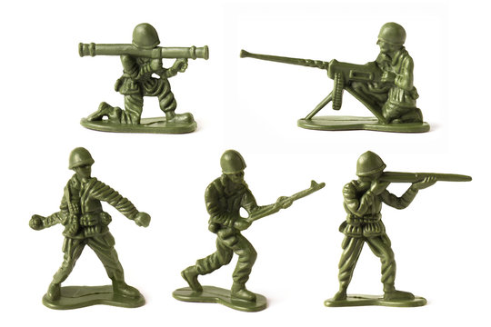 Collection of green toy plastic soldiers, isolated on white background