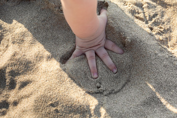Baby's Hands In The Sand, Baby Playing In The Sand