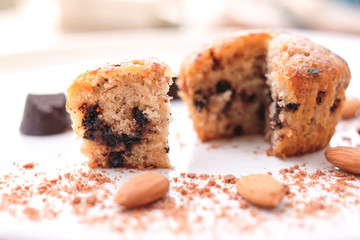 Muffin chocolate lava (banana cake) with chocolate chip, almond and banana smell on white plate for dessert background or texture - homemade concept.