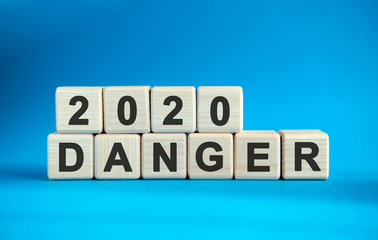 2020 DANGER word cube on a blue background.