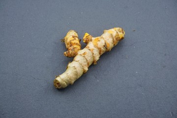 turmeric (Curcuma longa) on a black background.