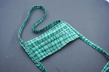 green mouth mask to cover mouth and nose so that dirty air does not enter the body. One way to prevent the transmission of Corona Covid-19 Virus is by using this tool.