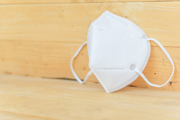 White N95 Mask on wood plate
