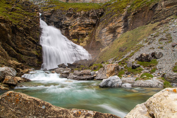 Photography at low speed with the movement of the water that falls through a waterfall.