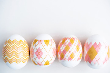 Russian traditional easter. Four painted eggs on a white background. Religious holiday Easter.