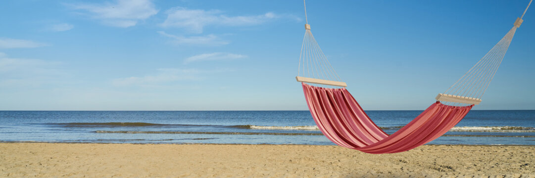 Empty Red Hammock On The Beach By The Sea In Summer (3D Rendering)