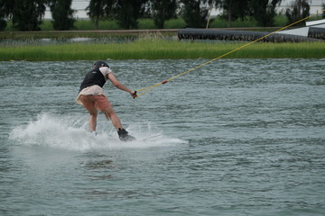 Young athlete Of Thailand is practicing sportWater Board at the wake park canal 6 on October 7,...