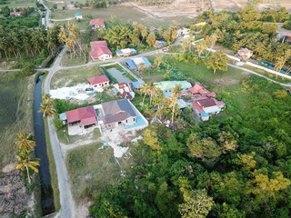 Malays village with green tree.