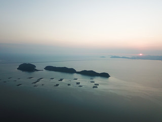 Aerial view Pulau Aman, Pulau Betong in sunset. Background is Penang Second Bridge.