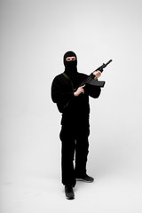 Man in mask With gun on white background	
