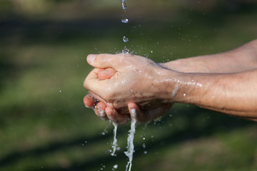 Man's hands are washed with soap. Disinfection prevention of viral diseases