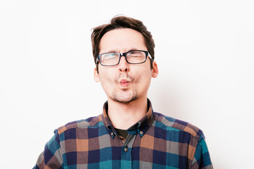 Man sucks his cheeks