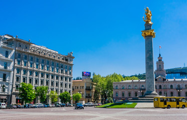  Freedom and Victory Square with the Freedom Monument showing St George Statue in a central column. Tbilisi City Hall behind. Located in Shota Rustaveli Avenue.