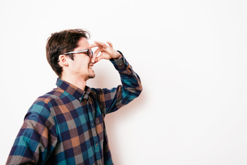 The stench. Closes the man's nose