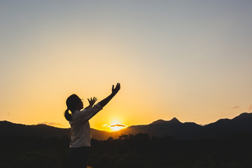 Woman open hands to pray to God for blessings.