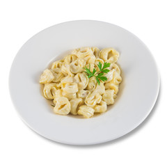 Dish of tortellini stuffed with meat and cream and a sprig of parsley.