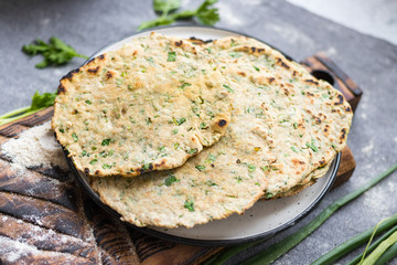 Flatbread with greens and herbs.  Traditional caucasus and Turkish bread.