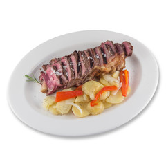 Beef cube roll dish with sliced baked potatoes.