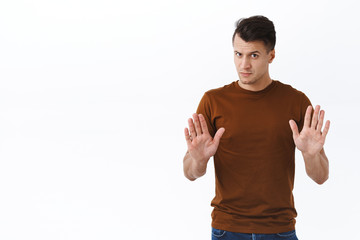Wow slow down, stay home please. Portrait of handsome serious-looking adult man trying to calm...
